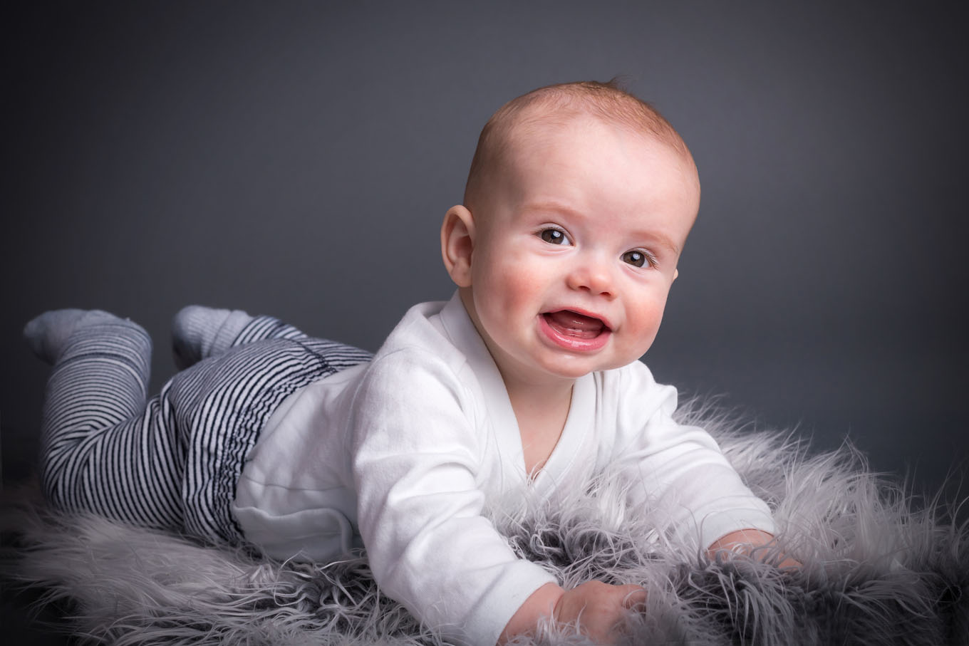 Portrait of a baby boy in a studio